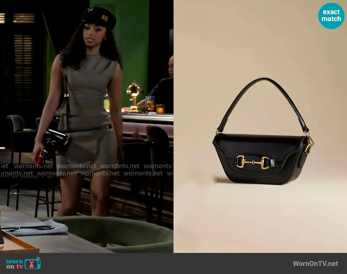 Anthropologie The Delilah Bag Horsebit Edition worn by Kat Richardson (Colby Muhammad) on Beyond the Gates