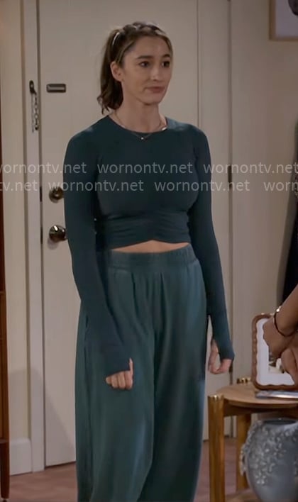 Ashley’s green long sleeve crop top and sweatpants on Beyond the Gates