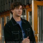 Beau’s black jacket with white stitching on Off Campus