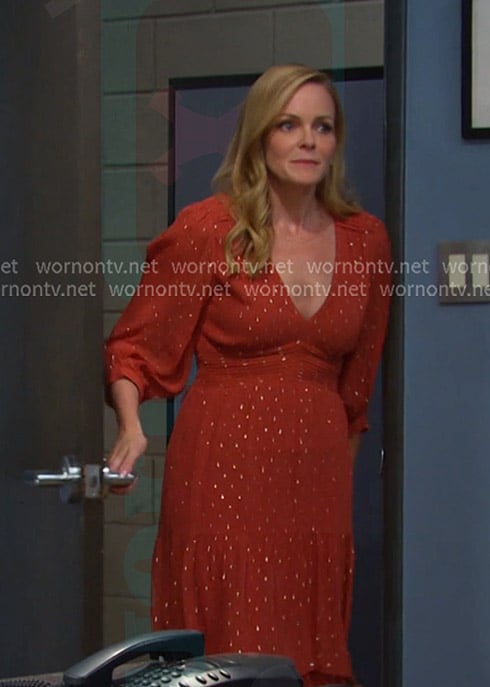 Belle’s orange v-neck tiered dress on Days of our Lives