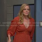Belle’s orange v-neck tiered dress on Days of our Lives