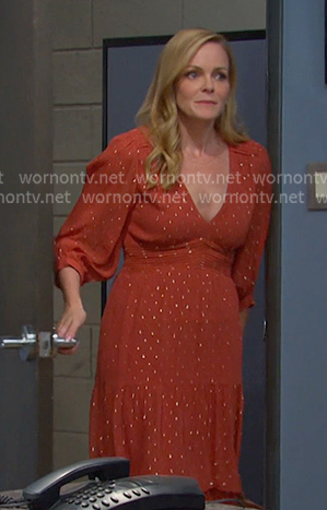 Belle’s orange v-neck tiered dress on Days of our Lives