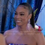 Chelsea’s purple sequin strapless dress and feather earrings on Beyond the Gates