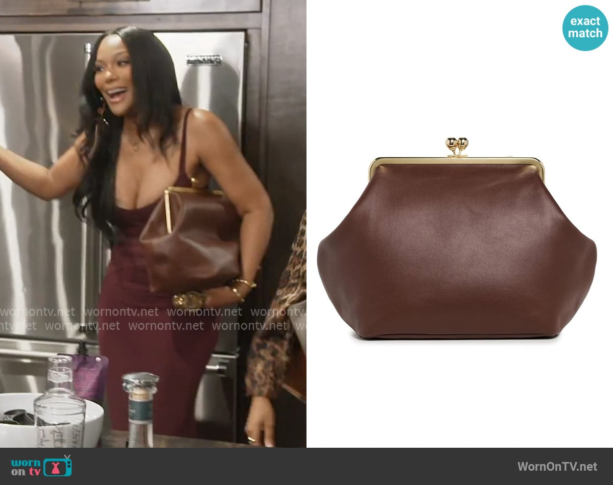 Coach Glovetanned Leather Large Kisslock Frame Clutch worn by Angela Oakley on The Real Housewives of Atlanta