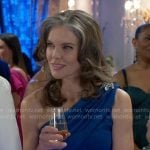 Diane’s blue one-shoulder dress on Beyond the Gates