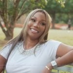 Drew’s white rhinestone embellished top on The Real Housewives of Atlanta