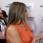 Emily's orange smocked dress on Access Hollywood