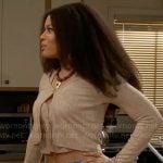 Eva's beige knit cardigan and lace-up side jeans on Beyond the Gates