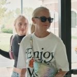 Galyna's white print tee and quilted bag on The McBee Dynasty Real American Cowboys