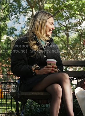 Georgina’s black quilted hooded coat on In The City