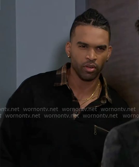 Izaiah’s black and plaid polo sweater on Beyond the Gates