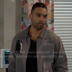 Izaiah's grey patch jacket on Beyond the Gates
