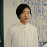 Jocelyn’s white twist neck blouse on Not Suitable For Work