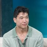 Joel Kim Booster’s greens stripe knit shirt on Access Hollywood