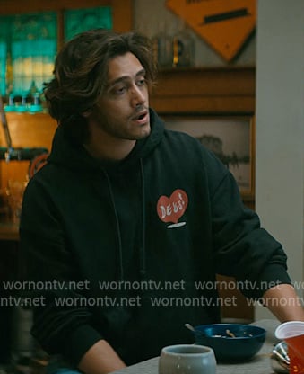 John’s black heart print hoodie on Off Campus