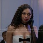 Kat’s white dress with black bows on Beyond the Gates