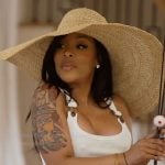 K’s white buckle tank on The Real Housewives of Atlanta