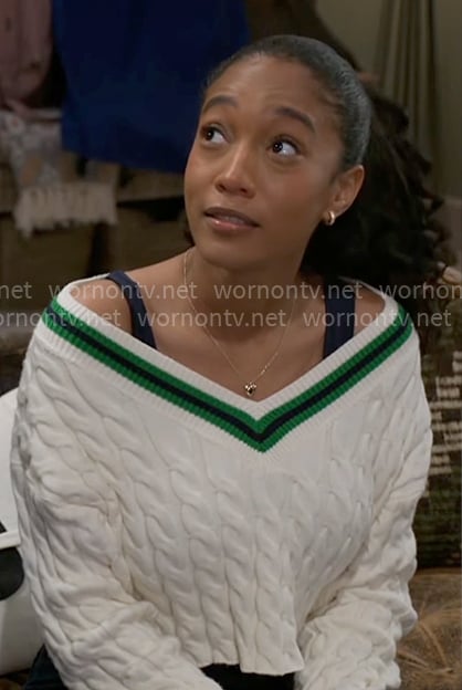 Samantha’s white sweater with green stripe trim on Beyond the Gates