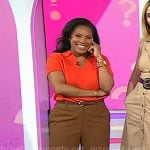 Sheinelle's red polo sweater and brown pants on Today