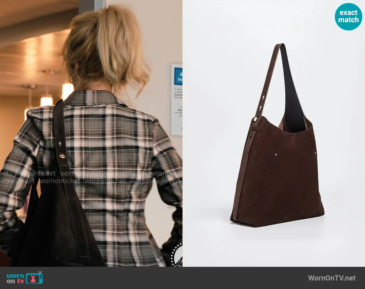 Tory Burch Romy Suede Hobo Bag worn by Beth Dutton (Kelly Reilly) on Dutton Ranch