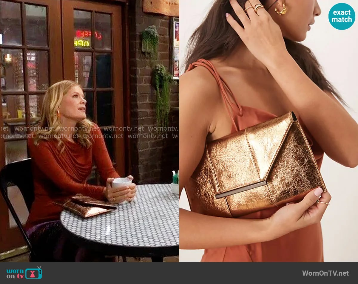 True Decadence Metallic clutch bag in bronze worn by Phyllis Summers (Michelle Stafford) on The Young and the Restless