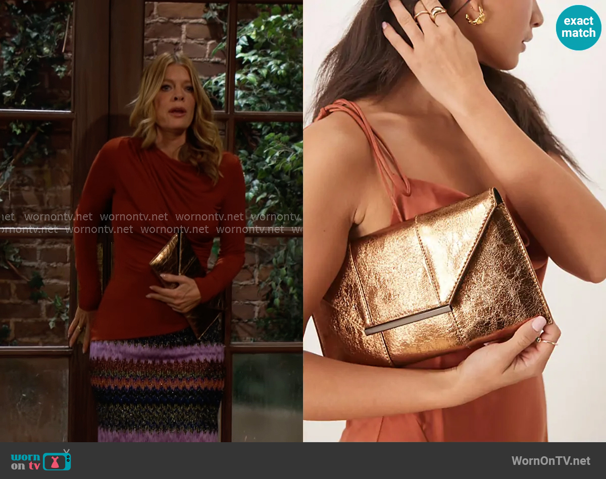 True Decadence Metallic clutch bag in bronze worn by Phyllis Summers (Michelle Stafford) on The Young and the Restless