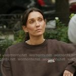 Whitney’s brown oversized sweatshirt on In The City