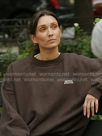 Whitney’s brown oversized sweatshirt on In The City