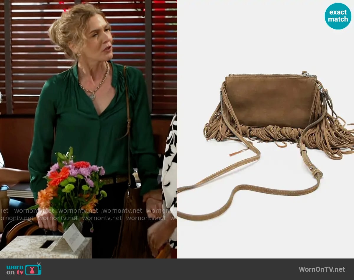 Zara Fringed Split Suede Mini Crossbody Bag worn by Jan Morgan (Jerri Tubbs) on Beyond the Gates
