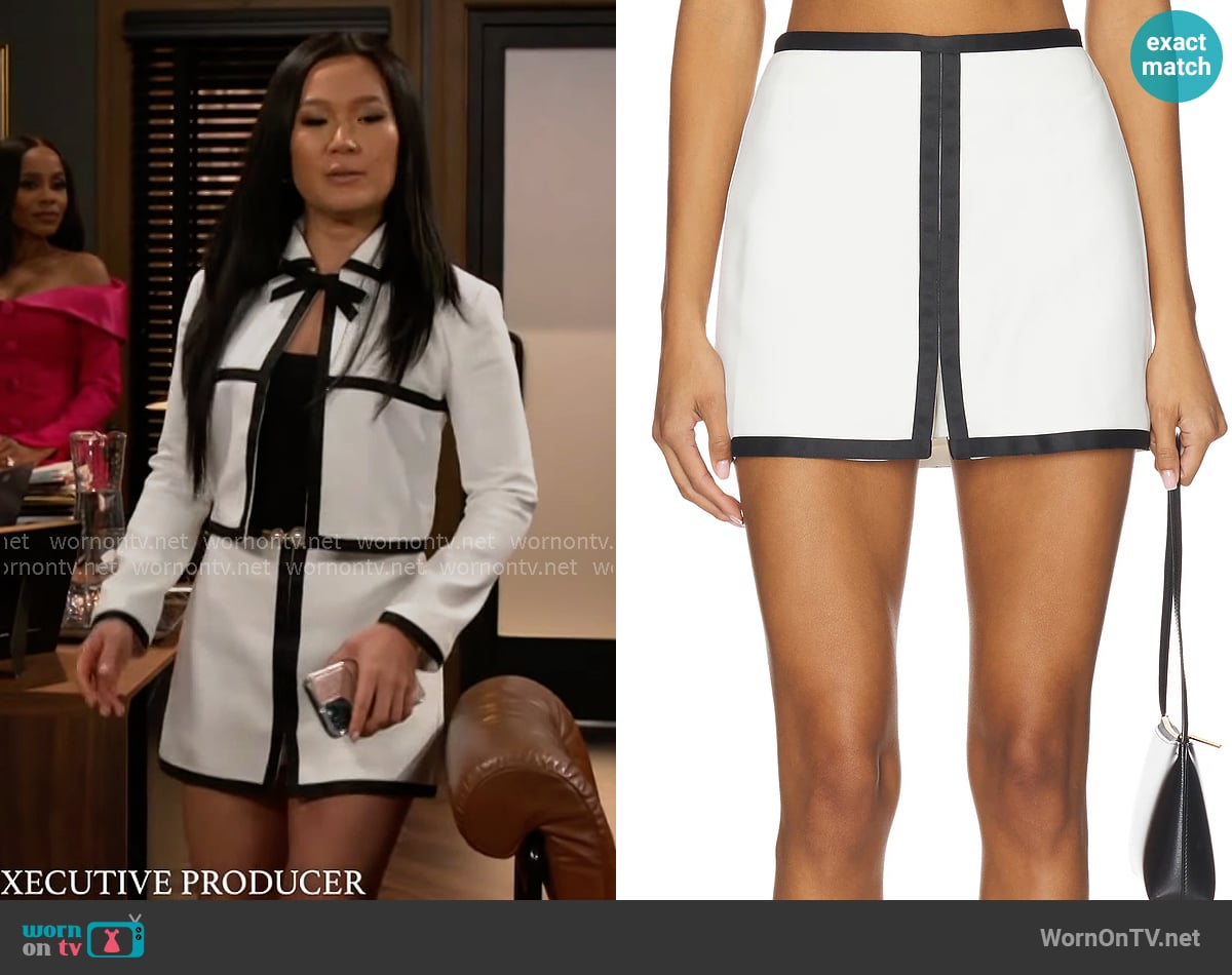 Caroline’s white skirt with black trims on Beyond the Gates Caroline’s white skirt with black trims on Beyond the Gates