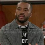 Andre's text t-shirt and grey jacket on Beyond the Gates