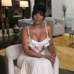 Angela's white floral confessional dress on The Real Housewives of Atlanta