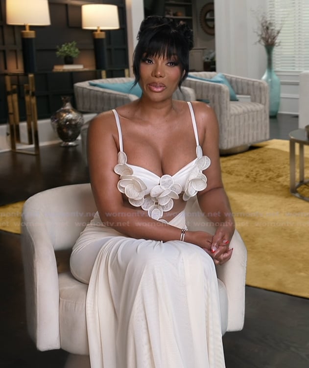 Angela’s white floral confessional dress on The Real Housewives of Atlanta