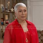 Anita’s red pleated shirt on Beyond the Gates