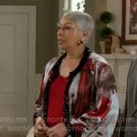 Anita’s red printed coat with beaded trim on Beyond the Gates