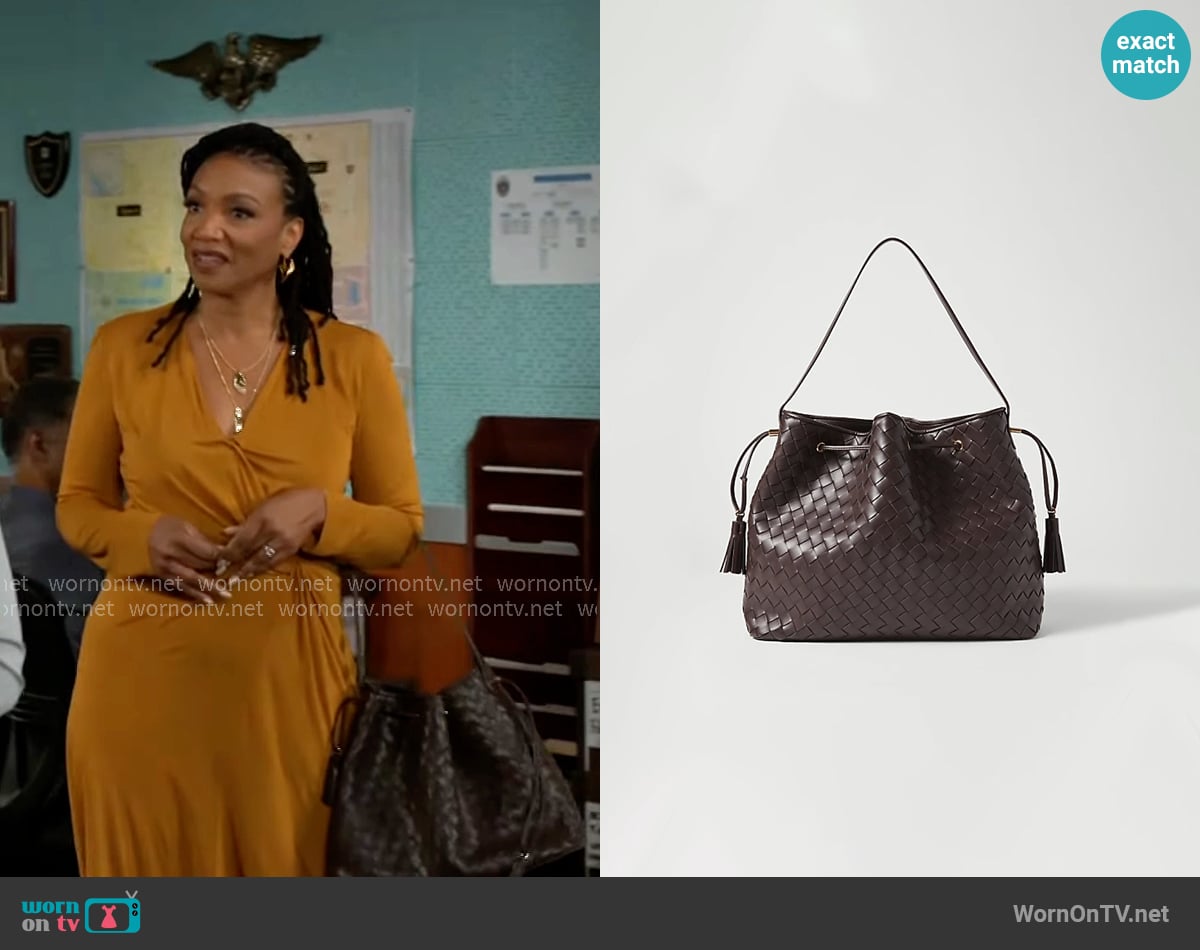 Ann Taylor Woven Drawstring Bucket Bag worn by Darlene Hawthorne (Monique Mosee) on Beyond the Gates