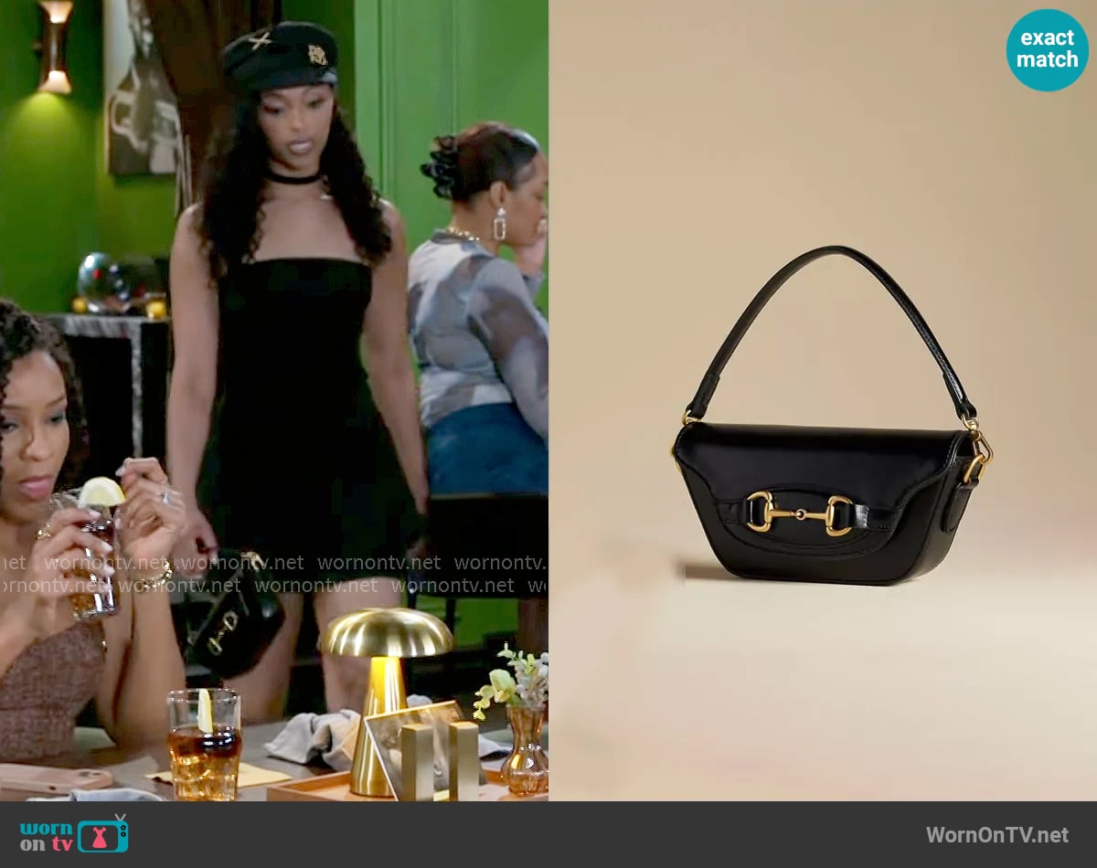 Anthropologie The Delilah Bag Horsebit Edition worn by Kat Richardson (Colby Muhammad) on Beyond the Gates
