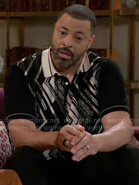 Bill’s black and white printed polo shirt on Beyond the Gates
