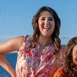 Brooke's floral dress, raffia belt, and red bag on The Five Star Weekend