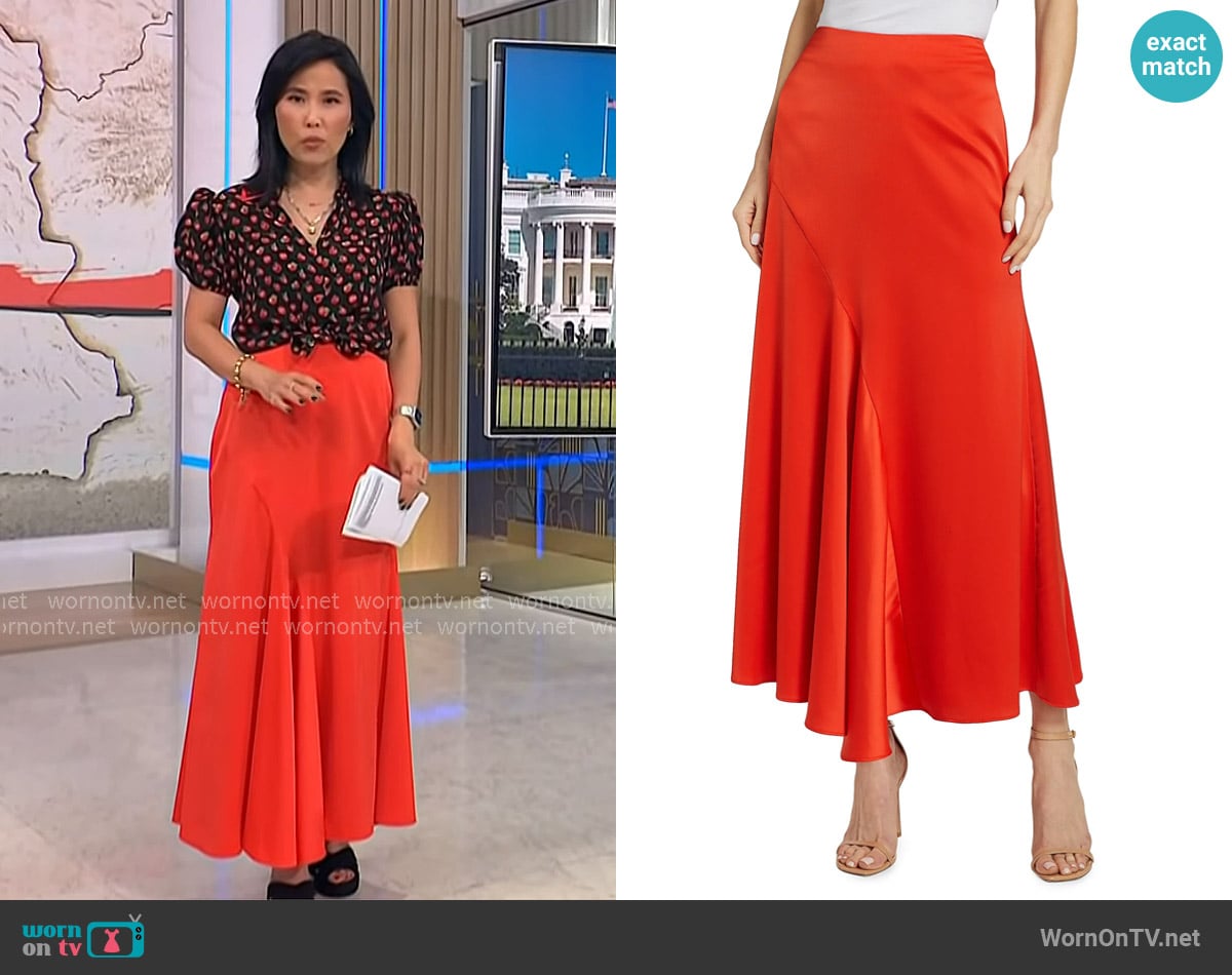 Derek Lam 10 Crosby Paulette Pleated Satin Midi-Skirt in Sunset worn by Vicky Nguyen on NBC News Daily
