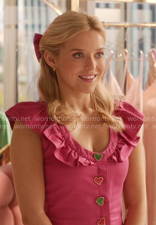 Elle’s pink ruffled dress with heart buttons on Elle