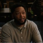 Emmett’s gray polo sweater on The Chi