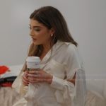 Gia’s white satin split sleeve blouse on Next Gen NYC