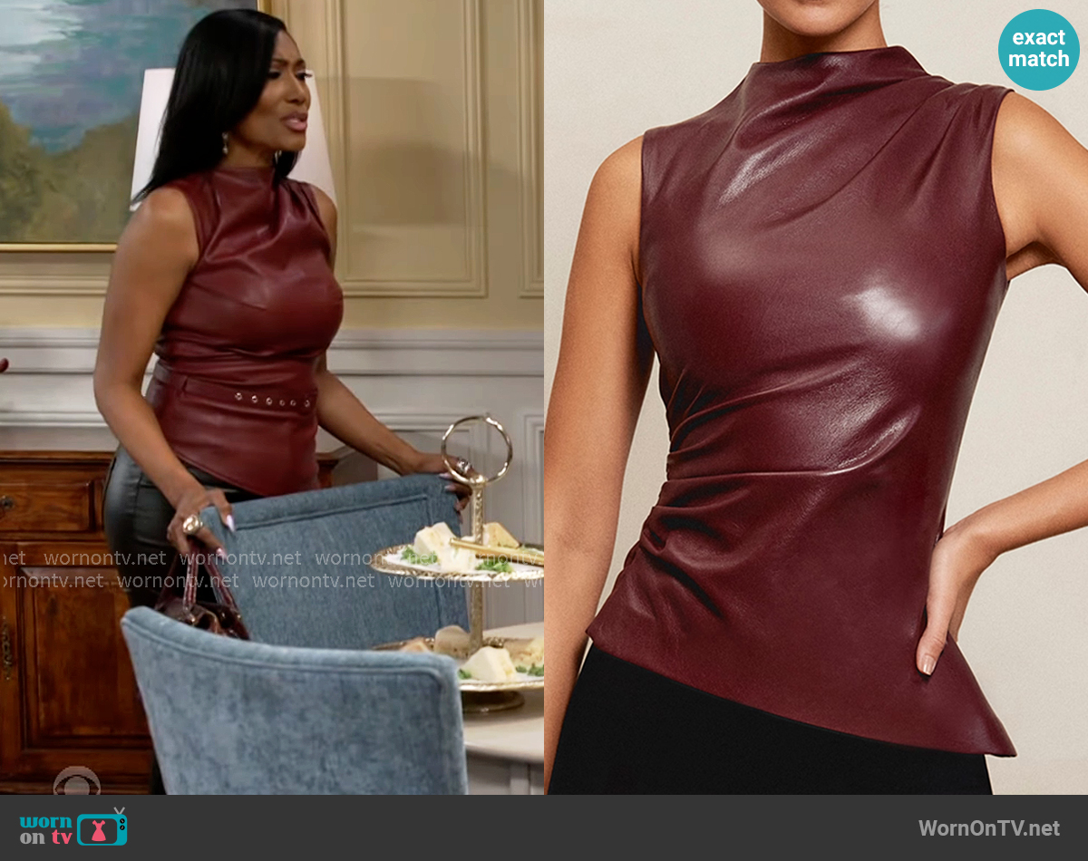 House of CB Wine Vegan Leather Asymmetric Top worn by Dana 'Leslie' Thomas (Trisha Mann-Grant) on Beyond the Gates