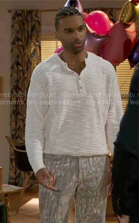 Izaiah’s cream textured sweater and printed pants on Beyond the Gates