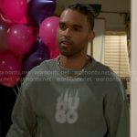 Izaiah’s green Hugo sweatshirt and printed pants on Beyond the Gates