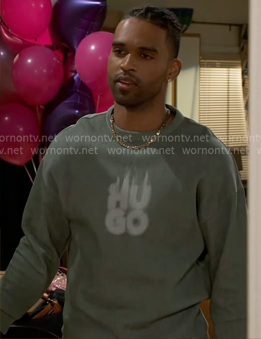 Izaiah’s green Hugo sweatshirt and printed pants on Beyond the Gates