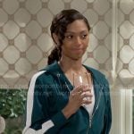 Kat's green tracksuit with side stripe on Beyond the Gates