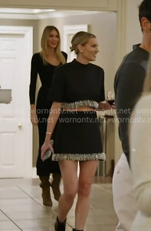 Lindsay’s black fringed crop top and mini skirt on In The City
