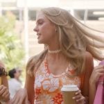 Madison's tropical print top and red skirt on Elle